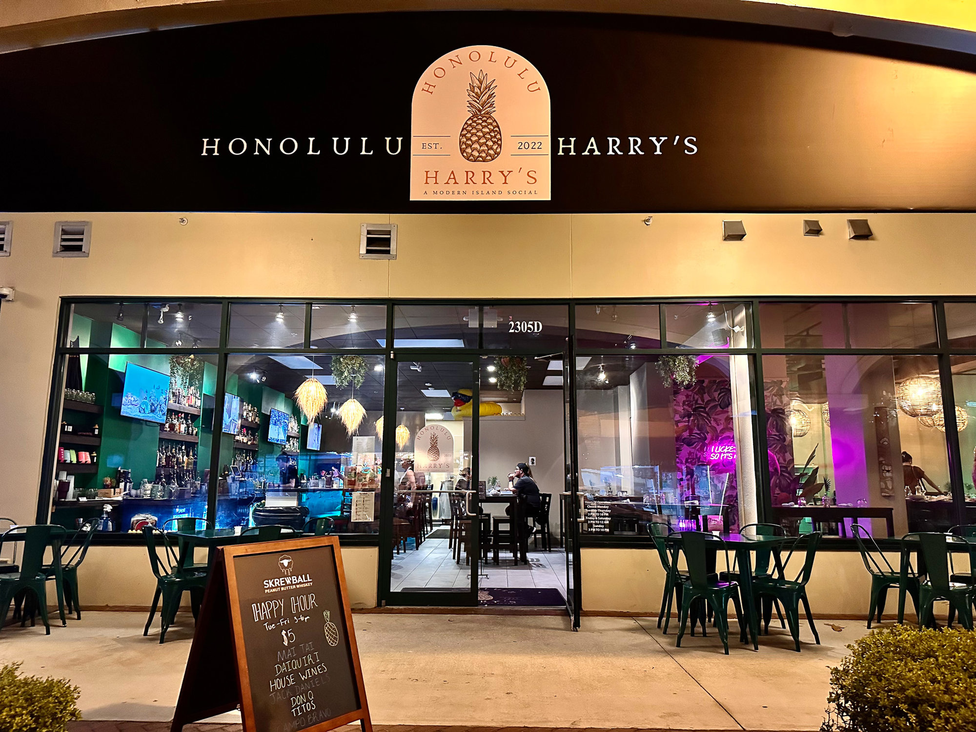 Exterior shot of Honolulu Harry's at night